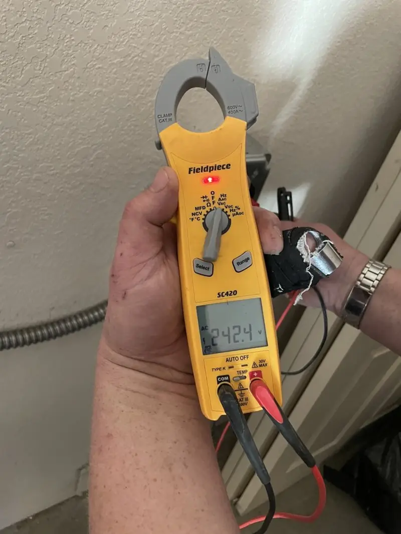 Voltage testing with clamp meter during Whole House Surge Protector in Oakmont